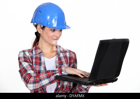 Female architect correcting designs Stock Photo