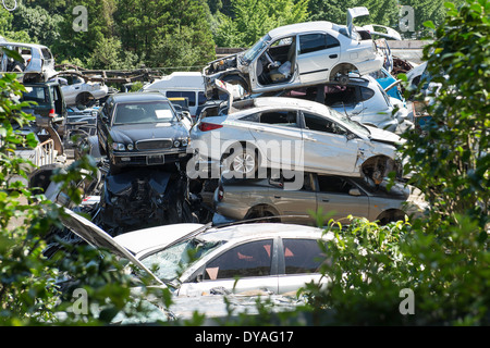 A pile of broken cars at a vehicle recycling station in South Korea Stock Photo