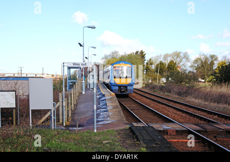 A diesel train leaving the remote railway station at Haddiscoe, Norfolk, England, United Kingdom. Stock Photo