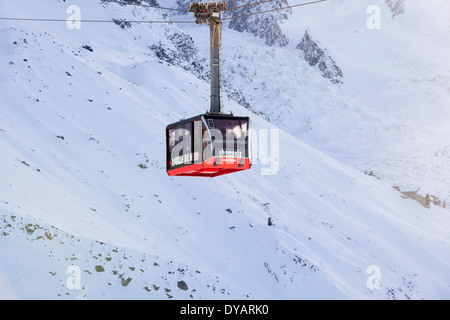 The Aiguille Du Midi gondola, carries passengers to the top of Aiguille Du Midi mountain above Chamonix Mont-Blanc, France. Stock Photo