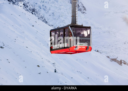 The Aiguille Du Midi gondola, carries passengers to the top of Aiguille Du Midi mountain above Chamonix Mont-Blanc, France. Stock Photo