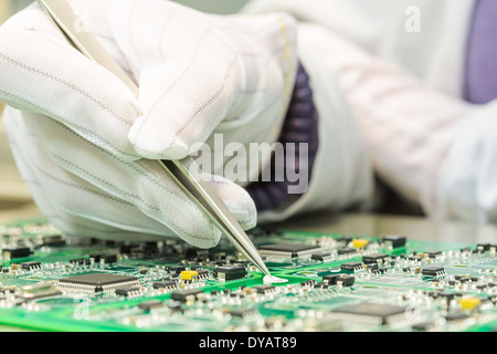 Engineering and electronic component quality control in QC lab on computer PCB turnkey manufacturing Stock Photo