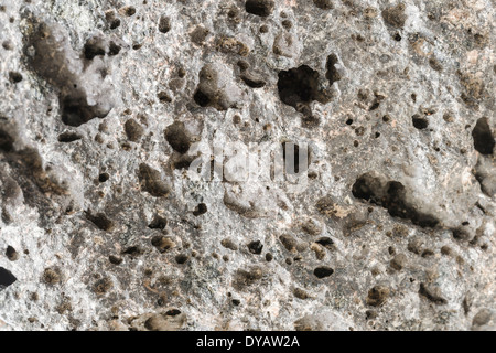 Pumice rough textured rock surface. Natural stone with freezes bubbles background. Stock Photo