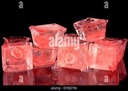 Red ice cubes on a black background Stock Photo