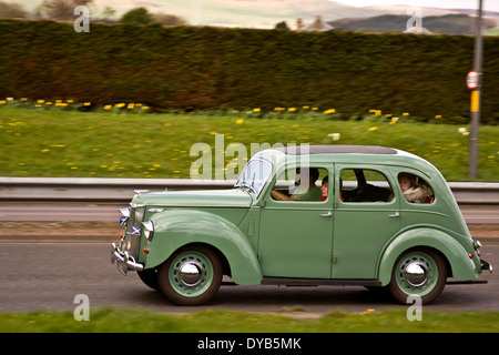 Panning a British Ford Prefect E493A Post War car travelling along the Kingsway West Dual Carriageway in Dundee, UK Stock Photo