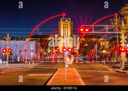 Blurred train crossing lights. San Diego County Administration Center building in the background. San Diego, California. Stock Photo