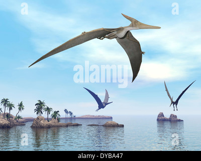 Three pteranodons flying over landscape with hills, palm trees and water. Stock Photo