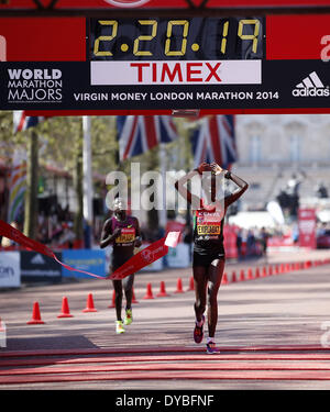 London, UK. 13th Apr, 2014. Edna Kiplagat(R) of Kenya celebrates after crossing the finish line of 2014 London Marathon in London, Britain on Apr. 13, 2014. Edna Kiplagat claimed the title of the Elite Women group with 2 hours 20 minutes and 21 seconds. Credit:  Wang Lili/Xinhua/Alamy Live News Stock Photo
