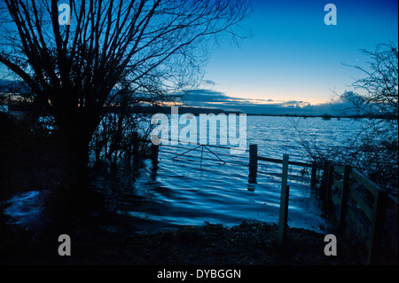 Dawn breaks over the flooded fields of the Somerset Levels near Burrowbridge UK Feb 2014 Stock Photo