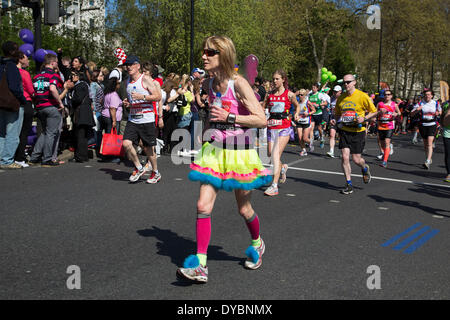 London, UK. 13th Apr, 2014. Competitors running in the main public event of the Virgin Money London Marathon 2014. These runners take part and raise huge sums fo money for charity organisations. It is a popular tradition for some people to dress up in amusing costumes. Credit:  Michael Kemp/Alamy Live News Stock Photo