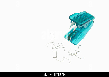 green Staple Remover staples Isolated on a white background, Stock Photo