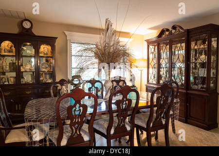 Showcase Dining Room Interior with table, chairs and curio cabinets, Florida, USA  2014 Stock Photo