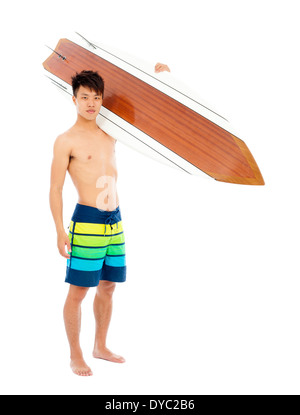 sunny surfer put surfboard on the shoulder in studio Stock Photo