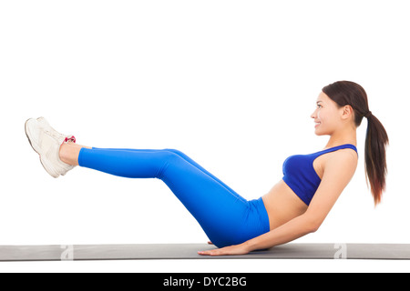 Woman doing abdominal crunches on exercise Stock Photo