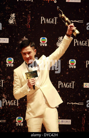 Hong Kong, China. 13th Apr, 2014. Nick Cheung, winner of the Best Actor award for his performance in the movie 'Unbeatable', shows his trophy at the presentation ceremony of the 33rd Hong Kong Film Awards (HKFA) in Hong Kong, south China, April 13, 2014. © Cai Fangya/Xinhua/Alamy Live News Stock Photo
