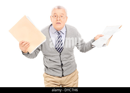 Senior man panicking with papers in his hand Stock Photo