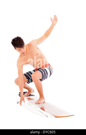 young surfer make a surfing pose Stock Photo