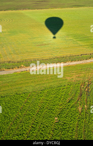 A birds-eye view of the Willamette valley and the shadow of a hot-air balloon in the spring. Oregon. USA Stock Photo