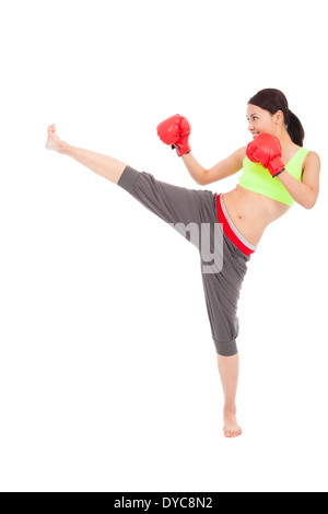 pretty sporty woman is kicking Stock Photo