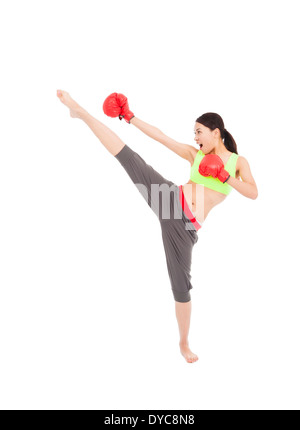 pretty female boxer is kicking and punching Stock Photo