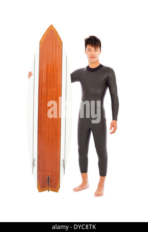 surfer man standing and holding a surfboard Stock Photo