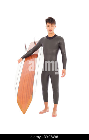 asian surfer man holding a surfboard Stock Photo