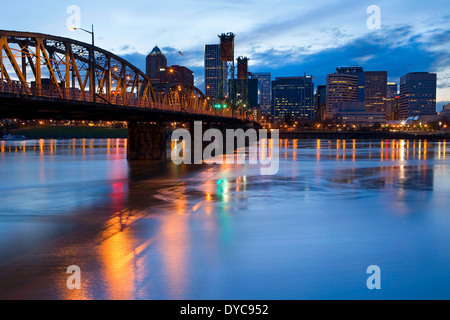 Downtown Portland, Oregon reflects off the Willamette River early in the evening. Portland, Oregon, USA Stock Photo