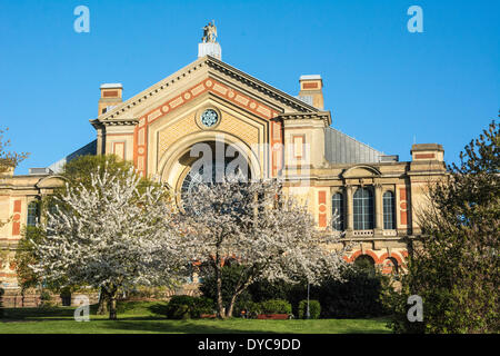 Alexandra Palace, London UK. 14th April, 2014. Daybreak sees Alexandra Palace and the cherry blossoms of its gardens basking in warm dawn light beneath a beautiful cloudless sky as London wakes up to a fine spring day. Credit:  Patricia Phillips/Alamy Live News Stock Photo