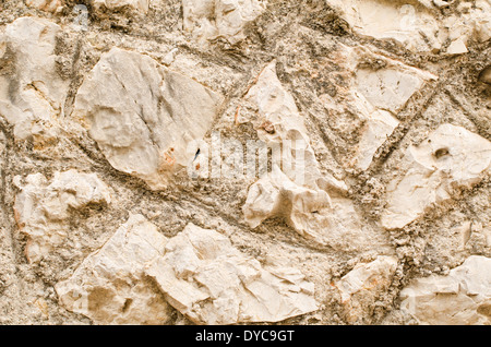 Full frame take of an old, irregular masonry wall Stock Photo