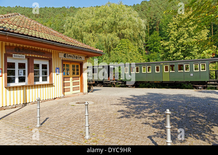 Europe Germany Rhineland-Palatinate Elmstein Bahnhofstrasse station building cars Kuckucksbähnel railroad steam vapour historic Stock Photo