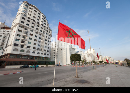 TANGIER, MOROCCO - MARCH 22, 2014: Ordinary morning with walking people on avenue Mohammed VI in new part of Tangier Stock Photo