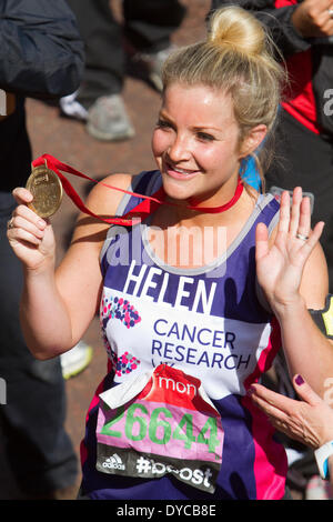 Helen Skelton with medal at the finishing line of the Virgin Money