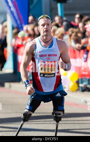 London, UK . 13th Apr, 2014. Athlete, Richard Whitehead of Great Britain is cheered by crowds of spectators as he runs over Tower Bridge during the Virgin London Marathon on 13th April 2014 in London, UK. Credit:  Jamie Hunt/Alamy Live News