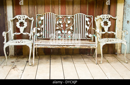 old rusty metal vintage bench and chair Stock Photo