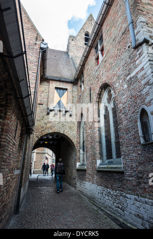 BRUGES, Belgium — The exterior of Sint-Janshospitaal (Old St. John's Hospital) stands as one of Europe's oldest surviving hospital buildings, dating to the 11th century. Originally established to care for pilgrims and travelers, the complex later expanded to include both monastery and convent facilities. This medieval building now serves as a museum preserving its architectural and medical heritage. Stock Photo