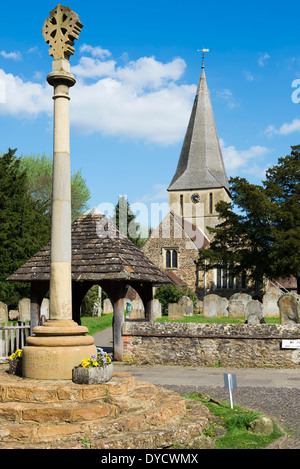 The war memorial and church of St James in the village of Shere on the North Downs, Surrey, UK Stock Photo