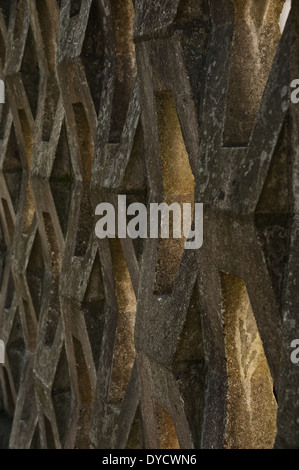 Diamond shaped cast concrete wall stones a  strong barrier that still allows light through screencast Stock Photo