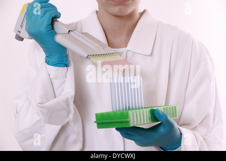 Girl student with multi-channel pipette, close up Stock Photo