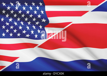 Flags of USA and Republic of Costa Rica blowing in the wind. Part of a series. Stock Photo