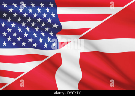 Flags of USA and Kingdom of Denmark blowing in the wind. Part of a series. Stock Photo