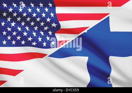 Flags of USA and Republic of Finland blowing in the wind. Part of a series. Stock Photo