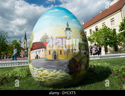 Zagreb, Croatia. 14th Apr, 2014. Photo taken on April 14, 2014 shows a huge hand-painted Easter egg on display near the Zagreb Cathedral on Kaptol in Zagreb, capital of Croatia, April 14, 2014. Several Easter eggs, painted in Croatian Naive art style by artists from the Koprivnica-Krizevci County, were set up in downtown Zagreb to celebrate Easter. © Miso Lisanin/Xinhua/Alamy Live News Stock Photo