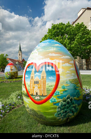Zagreb, Croatia. 14th Apr, 2014. Photo taken on April 14, 2014 shows huge hand-painted Easter eggs on display near the Zagreb Cathedral on Kaptol in Zagreb, capital of Croatia, April 14, 2014. Several Easter eggs, painted in Croatian Naive art style by artists from the Koprivnica-Krizevci County, were set up in downtown Zagreb to celebrate Easter. © Miso Lisanin/Xinhua/Alamy Live News Stock Photo