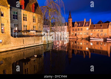 BRUGES, Belgium - Sometimes called 'The Venice of the North,' the historic Flemish city of Bruges has canals running through the old town. Before the water access became silted up, Bruges was a major commercial port. Medieval architecture and serene canals shape the cityscape of Bruges, often referred to as 'The Venice of the North'. As a UNESCO World Heritage city, Bruges offers visitors a journey into Europe's past, with its well-preserved buildings and cobblestone streets reflecting the city's rich history. Stock Photo