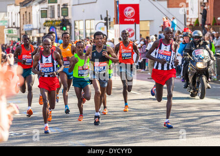 London UK. 13 April 2014 London Virgin Money Marathon Elite Men including the eventual winner Wilson Kipsange (Kenya), Stanley Biwott (second)(Kenya) and Tsegaye Kebede (third)(Ethiopia) with pacemakers Credit:  John Henshall/Alamy Live News JMH6130 Stock Photo