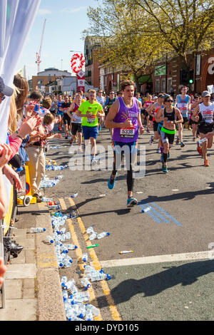 London UK. 13 April 2014 London Virgin Money Marathon runners showing discarded water bottles Credit:  John Henshall/Alamy Live News JMH6136 Stock Photo