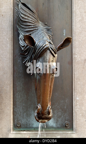 Bronze sculpture of a horse’s head, water fountain, Bruges, Belgium Stock Photo