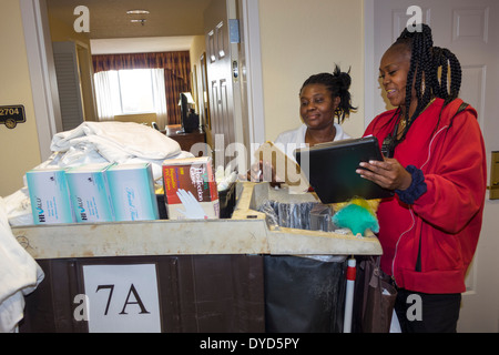 Orlando Florida,Allure Resort International Drive,hotel hotels lodging inn motel motels,hall,hallway,housekeeping staff,Black Blacks African Africans Stock Photo