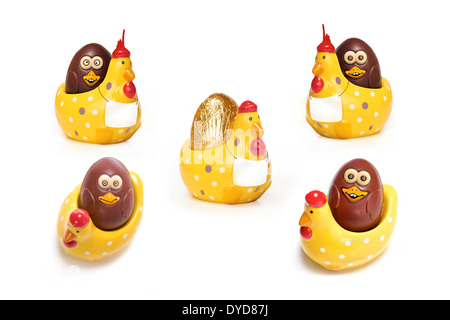 A collection of chocolate Easter eggs in hen egg cups. Stock Photo