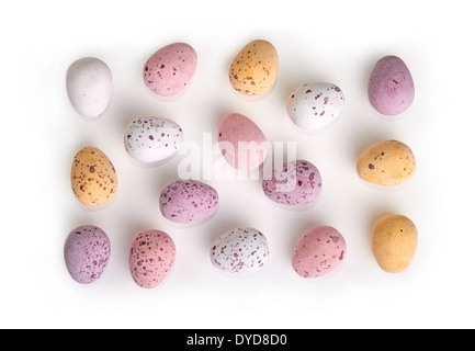 A selection of chocolate Easter Eggs with a candy crunchy shell on a white background. Stock Photo